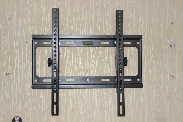 Adjustable tilt LCD TV rack