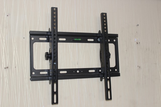 Adjustable tilt LCD TV rack