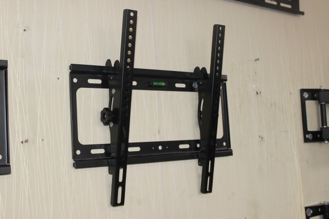 Adjustable tilt LCD TV rack