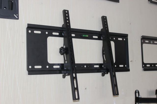 Adjustable tilt LCD TV rack