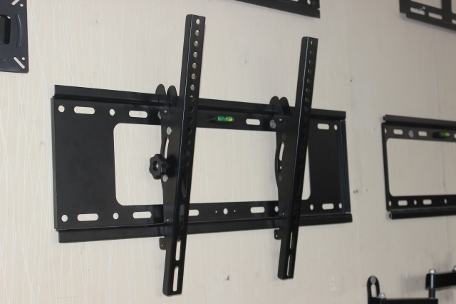 Adjustable tilt LCD TV rack